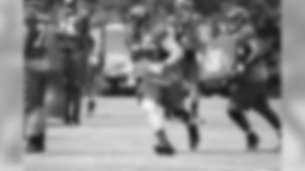 T Sam Baker runs through a drill