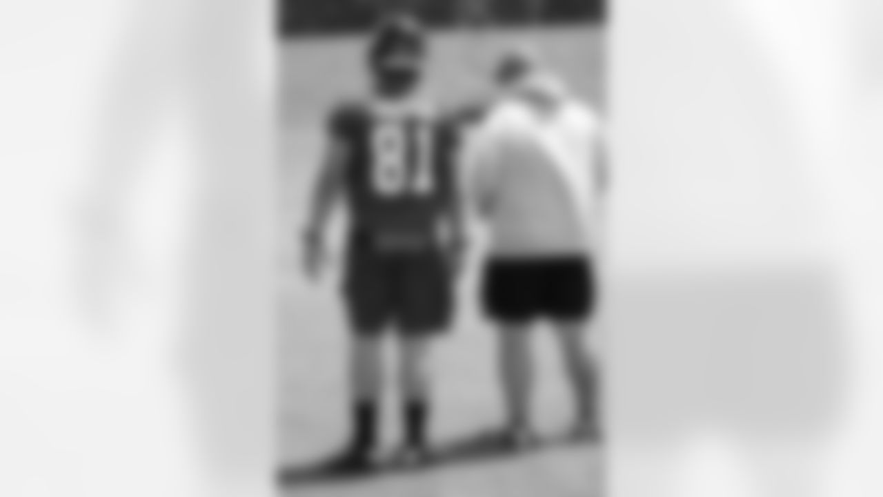Third-round tight end Austin Hooper stands with tight ends coach Wade Harman
