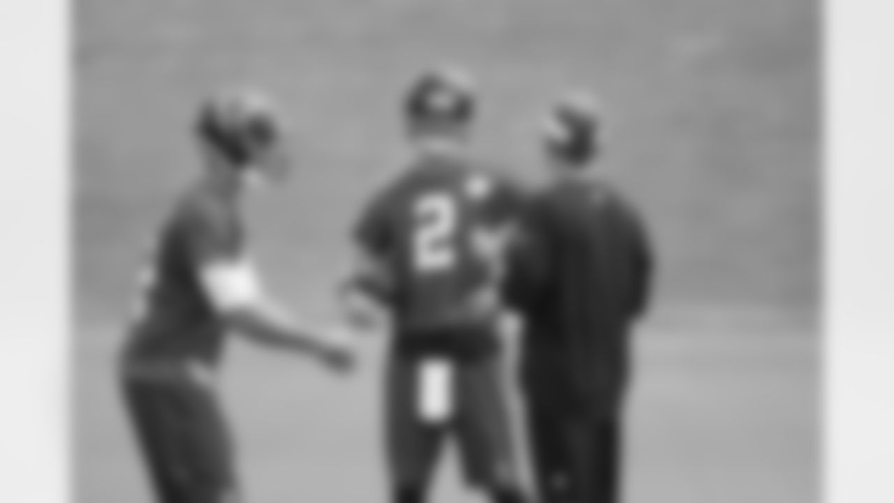 QB Sean Renfree and QB Matt Ryan talk to offensive coordinator Dirk Koetter