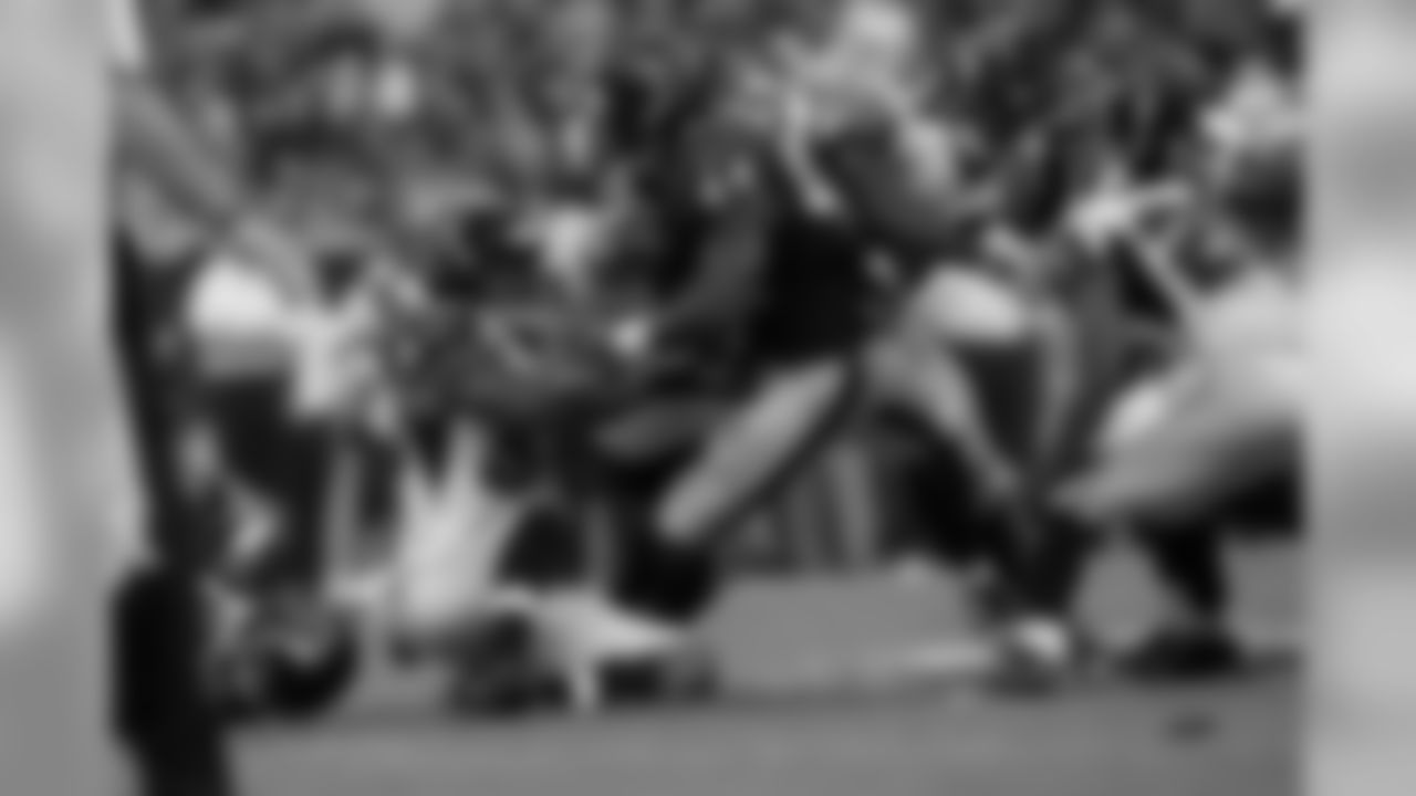 Falcons defensive players combine to tackle Houstons' RB Afred Blue.