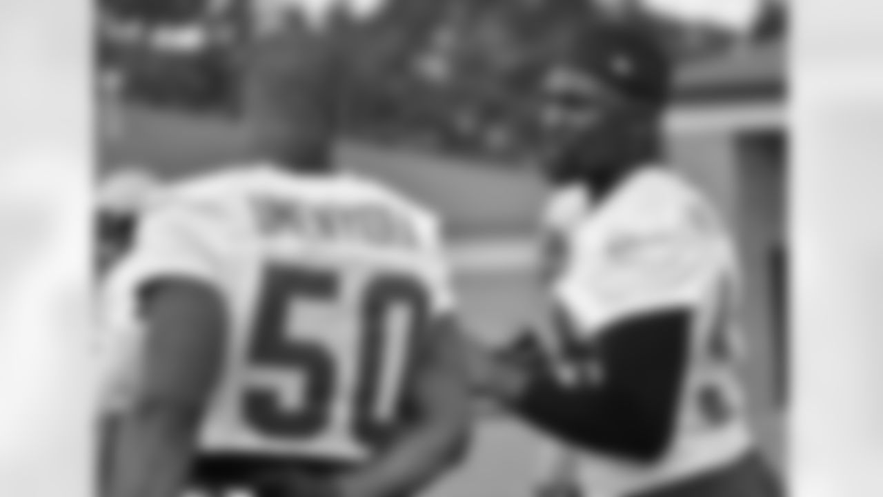 DE Osi Umenyiora and DE Jonathan Massaquoi