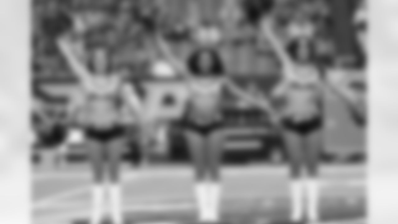 The Atlanta Falcons Cheerleaders perform on the field before the Falcons vs. Raiders game