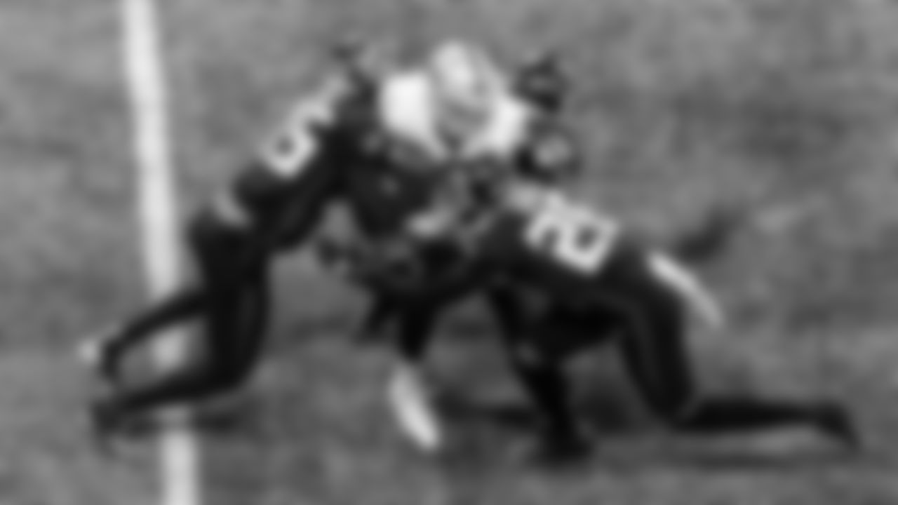 Atlanta Falcons wide receiver Brandon Powell #15, linebacker Mykal Walker #43, cornerback Isaiah Oliver #26 make a tackle during the second quarter against the Las Vegas Raiders on November 29, 2020.