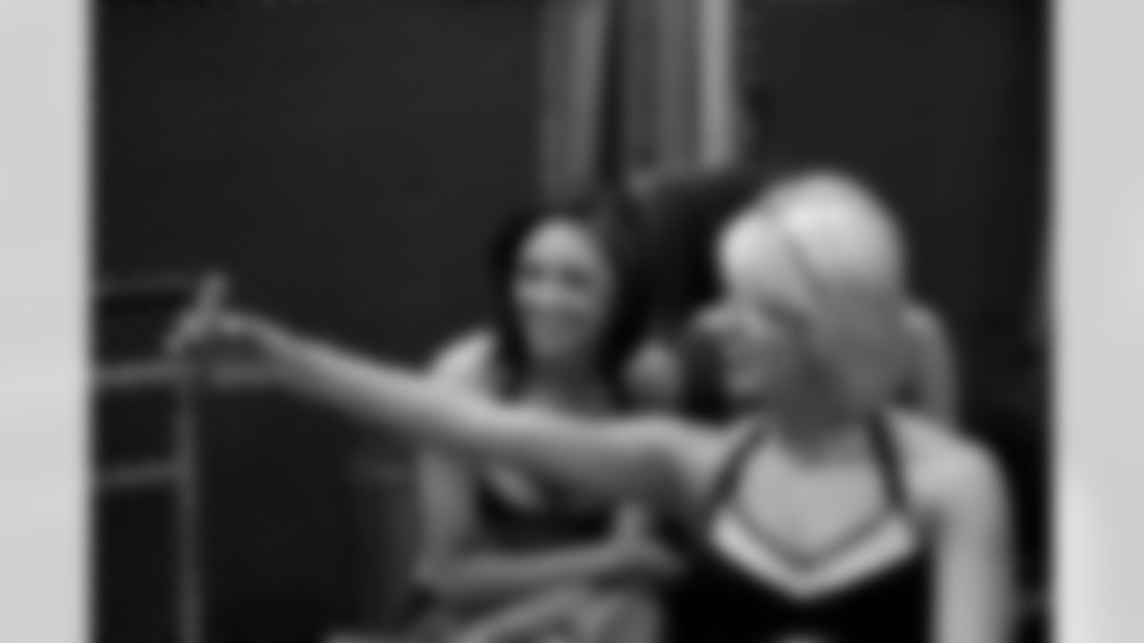 Cheerleaders Reneau K. and Brittiney W. snap a few photos of their own // 2011 Atlanta Falcons Cheerleaders Photo Shoot - Behind the Scenes // 5/22/11 // Atlanta, Ga. —