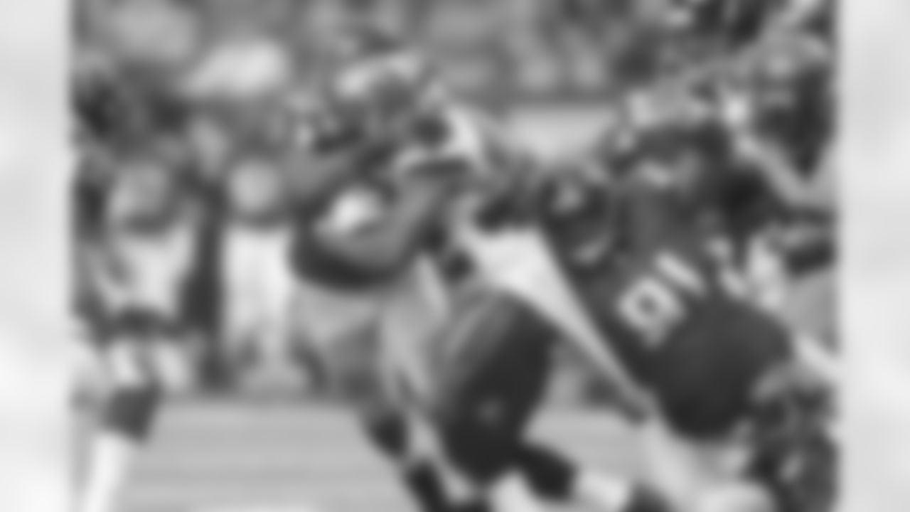 Jonathan Babineaux grabs cloth as Corey Peters and Akeem Dent go in for the tackle