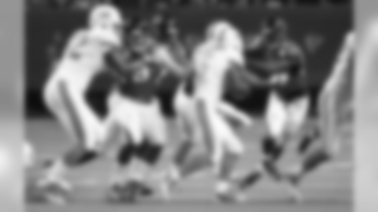 LB Tyler Starr and LB Prince Shembo fight through the line attempting to reach Dolphins RB Damien Williams.