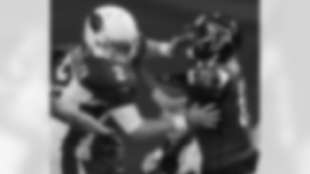 WR Devin Hester is grabbed by Cardinals P Drew Butler as he approaches the end zone on a punt return