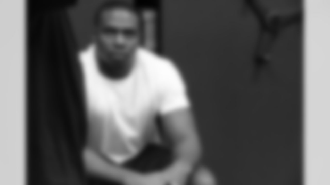 Falcons fifth-round pick, DE Jonathan Massaquoi, waits to get fitted for cleats // 2012 Rookies Report // May 10, 2012 // Flowery Branch -