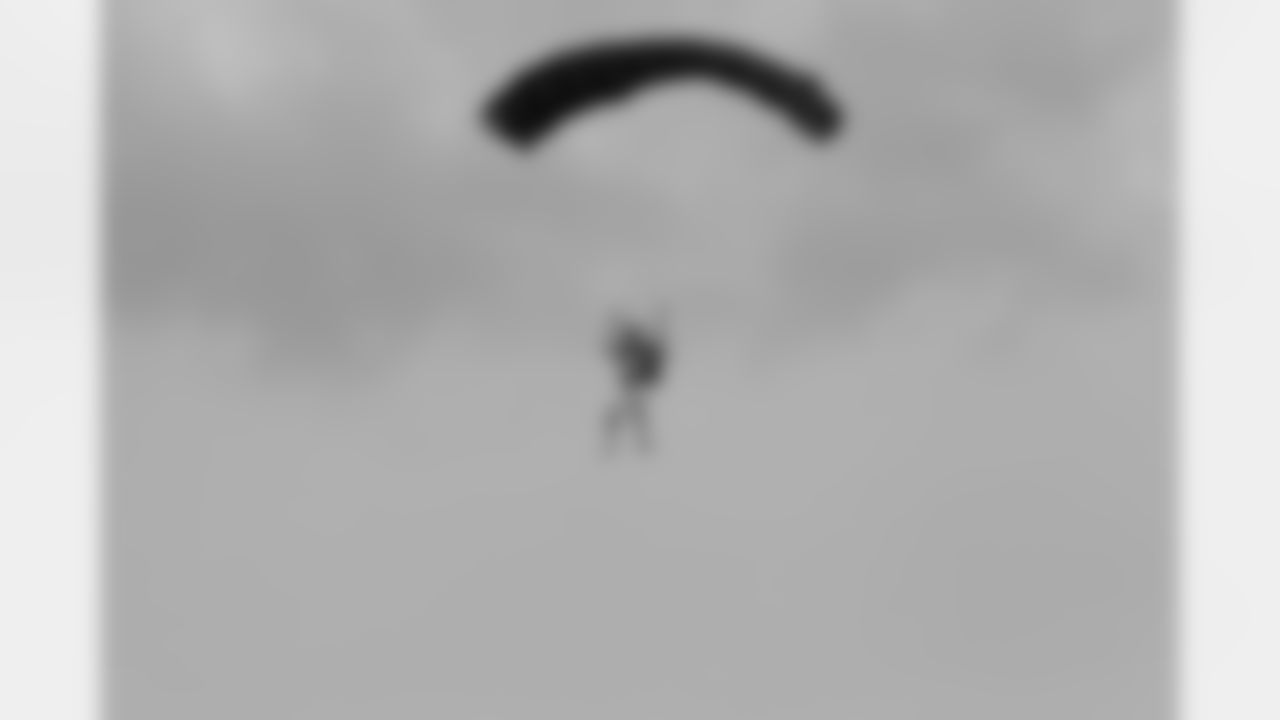 A skydiver comes in for a landing