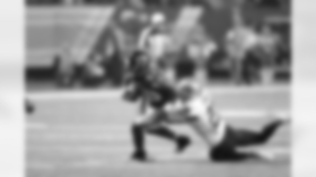 WR Harry Douglas works to shake Saints S Malcolm Jenkins