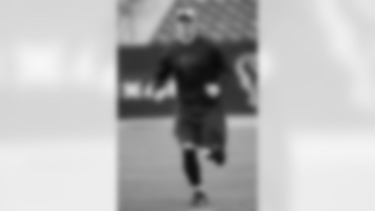 DE Kroy Biermann warms up before the game.