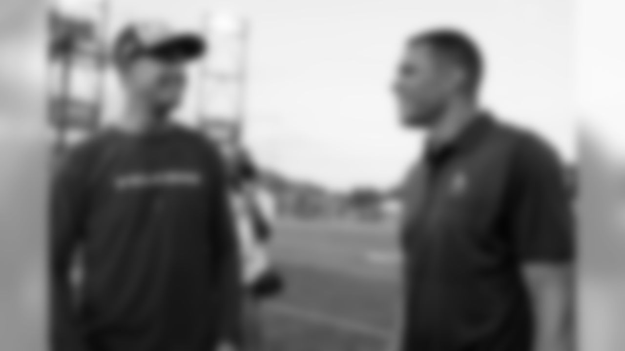 Hall of Fame inductee Tony Gonzalez talks with Atlanta Falcons quarterback Matt Ryan #2 before the game against the Denver Broncos at Tom Benson Hall of Fame Stadium in Canton, Ohio, on Thursday August 1, 2019. (Photo by Kara Durrette/Atlanta Falcons)