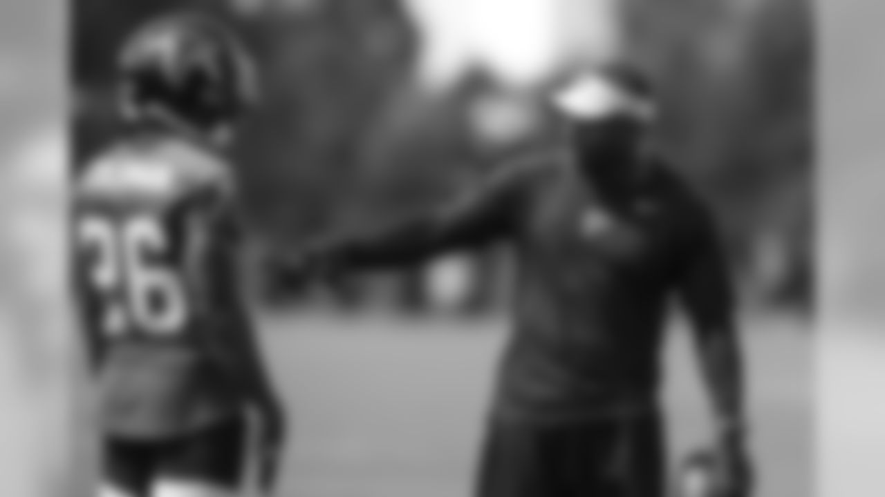 Marquand Manuel, defensive coordinator, and RB Tevin Coleman