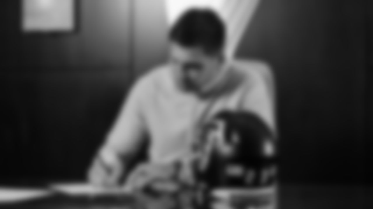 Kaden Elliss signs a contract during the Free Agency period at the Atlanta Falcons Training Facility in Flowery Branch, Ga. on Thursday, March 16, 2023. (Photo by Jay Bendlin/Atlanta Falcons)