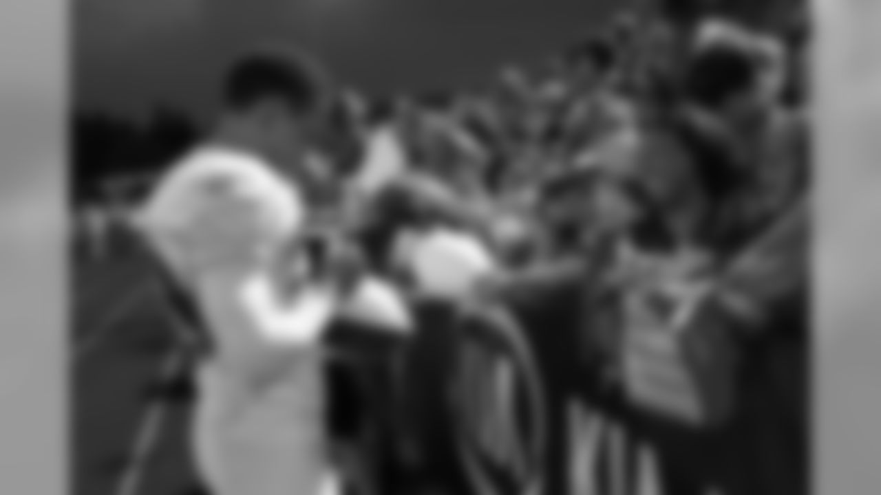 Brent Grimes puts his name on a football // 2011 Friday Night Lights // August 5, 2011 // Norcross, Ga. —