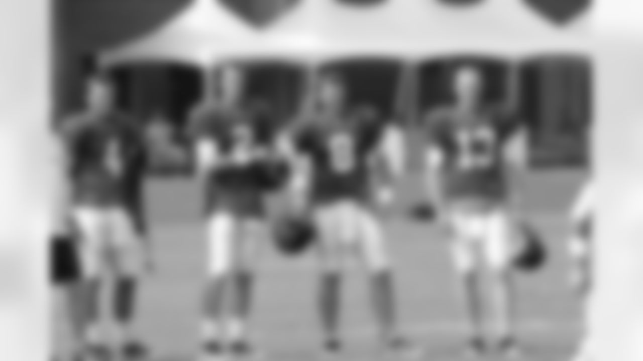 The quarterbacks look on as special teams practice // 2011 Russell Athletic Training Camp - Day 8 // August 8, 2011 // Flowery Branch, Ga. —