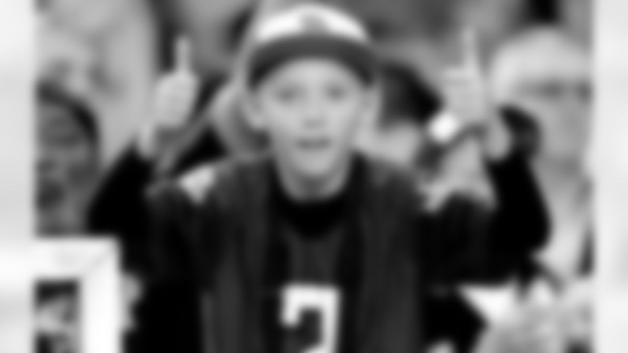 Thumbs up from a young Falcons fan in the stands