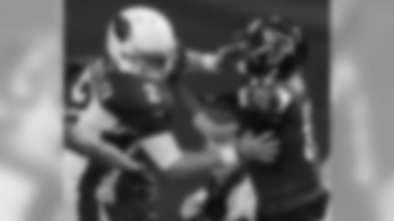 WR Devin Hester goes up against Cardinals P Drew Butler