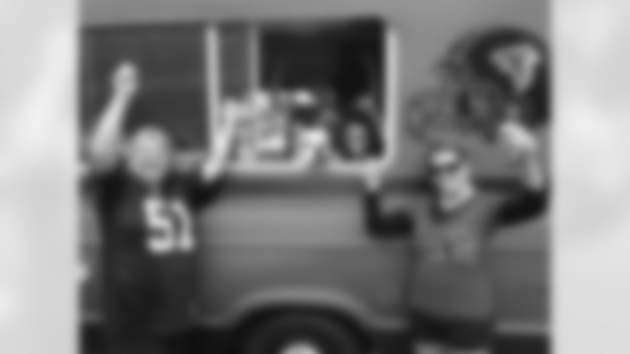 A few Falcons fans tailgating before the game