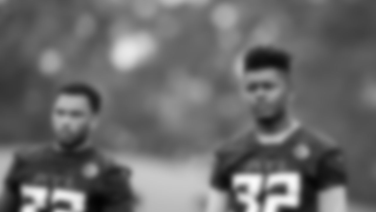 Atlanta Falcons cornerback Tyler Hall #33 looks on with safety Jaylinn Hawkins #32 during field work drills in Phase II of the Atlanta Falcons offseason program on May 18, 2021.
