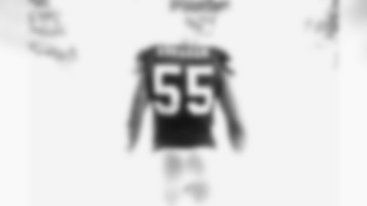 Through the smoke comes defensive end John Abraham.