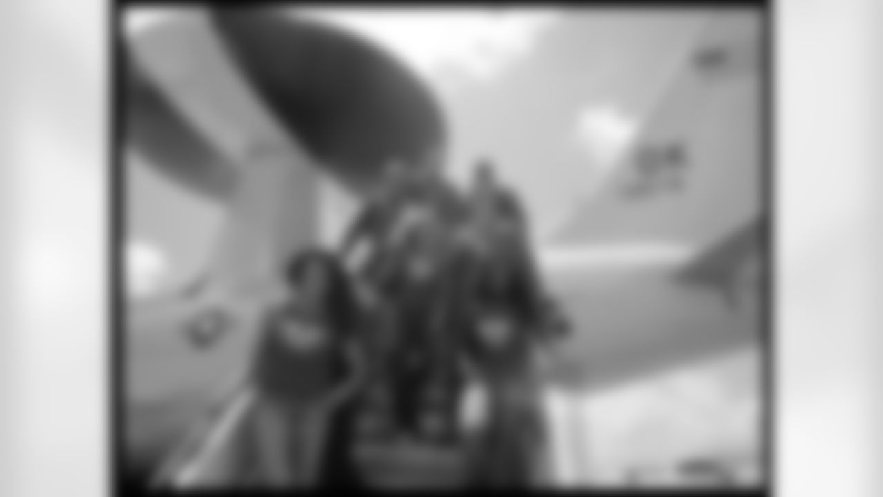 Alicia D., Sara D., Sabrina C. and Shamea M. pose on an Air Force plane with some airmen station in Curacao // 6/9-12/11 // Curacao -