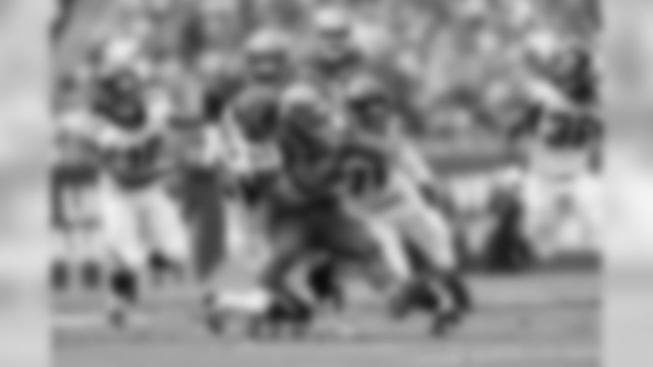 LB Paul Worrilow and DE Kroy Biermann combine on a tackle