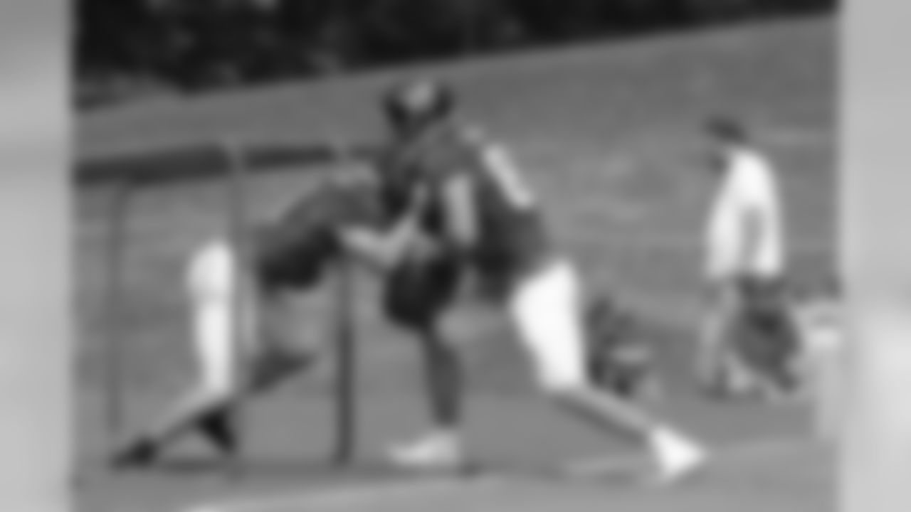Offensive linemen work on a drill during practice