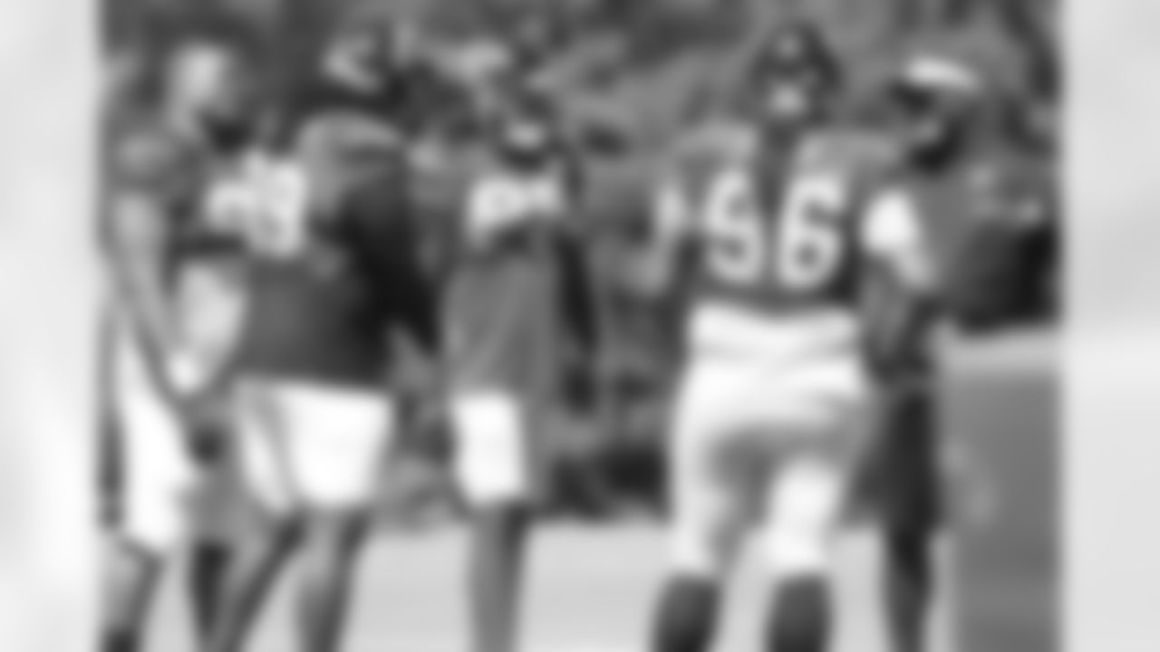 The defensive line and defensive line coach, Bryan Cox