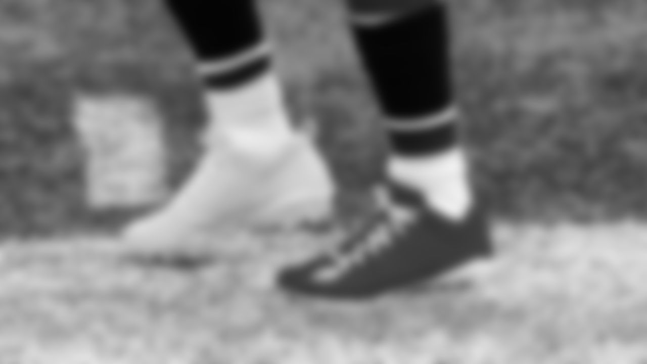 Atlanta Falcons running back Brian Hill #23 wears cleats to support Partners Against Domestic Violence (PADV) before the game against the New Orleans Saints on December 6, 2020.