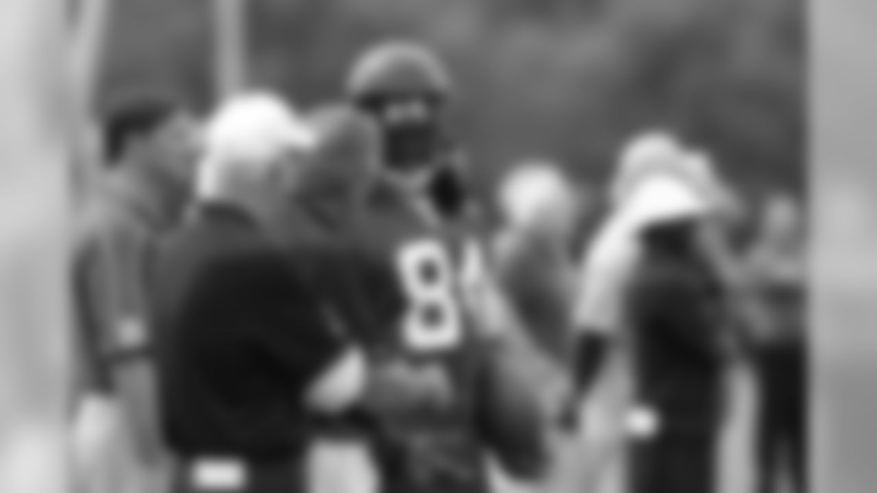 WR Roddy White chats with Falcons owner and chairman Arthur Blank
