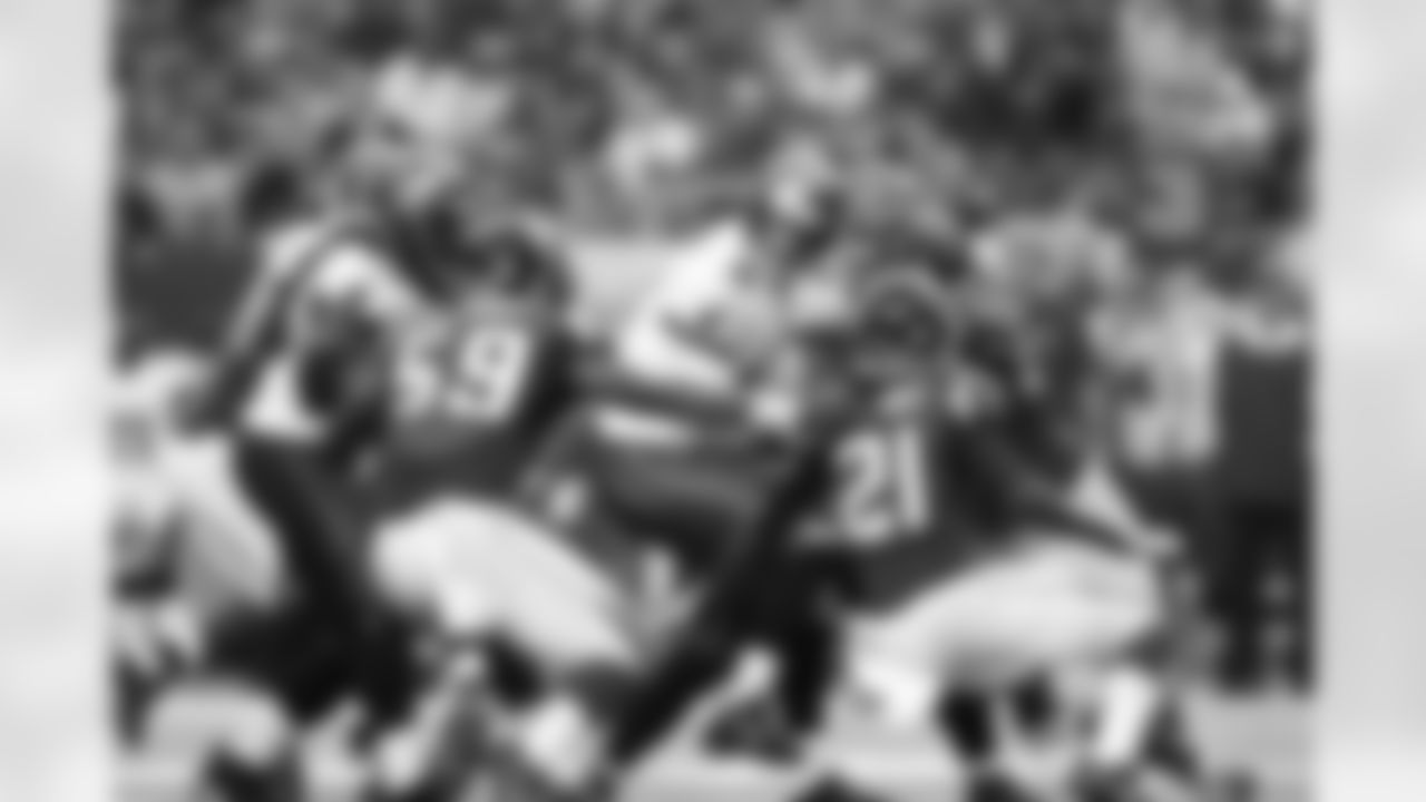 Tampa Bay quarterback Mike Glennon gets surrounded by Falcons defenders