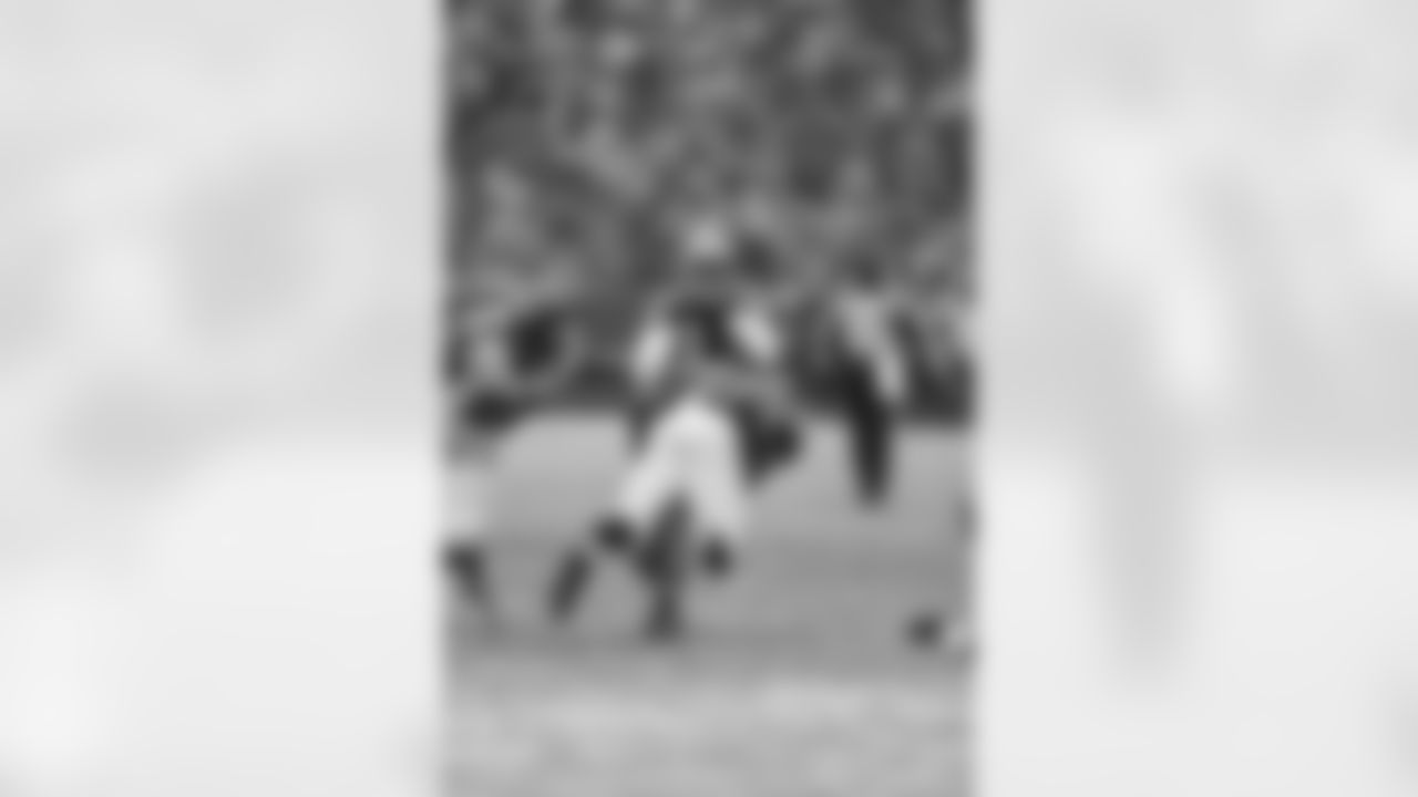 DE Jonathan Massaquoi launches into Packers CB Micah Hyde
