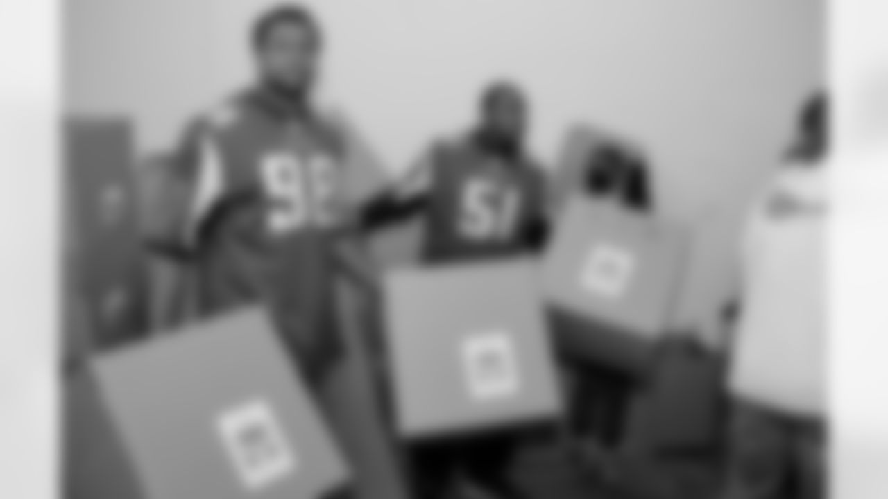 Cliff Matthews, left, and Robert James organize boxes.