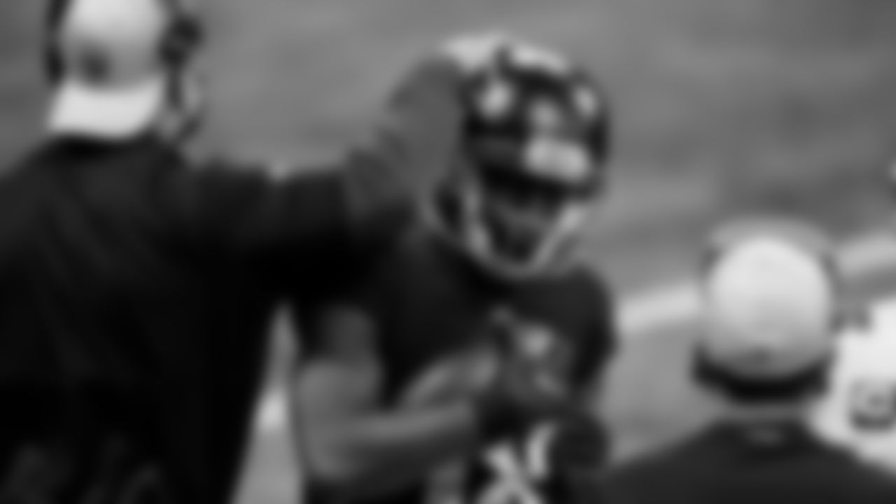 Atlanta Falcons wide receiver Calvin Ridley #18 gets tapped on the helmet by Jeff Ulbrich against the Tampa Bay Buccaneers on December 20, 2020.