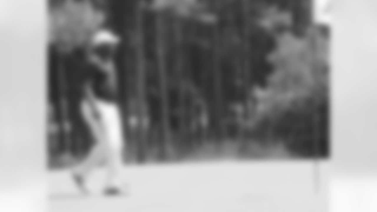 Secondary coach Tim Lewis gets ready to putt on the 15th hole // Verizon Wireless Network of Champions Golf Tournament - 2012 // June 18, 2012 // Suwanee, Ga., -