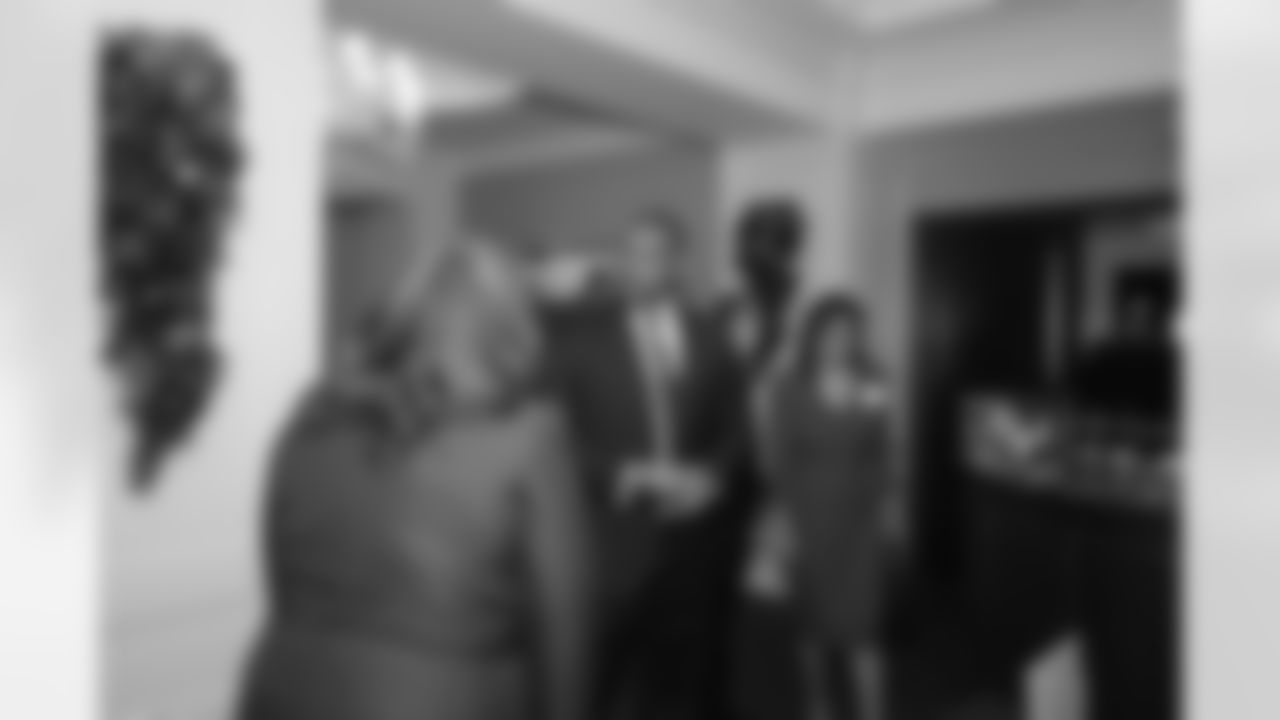Corey Peters welcomes his mother, Vanessa, to the event // 2011 Falcons Community Honors Dinner // Dec. 5, 2011 // Atlanta -