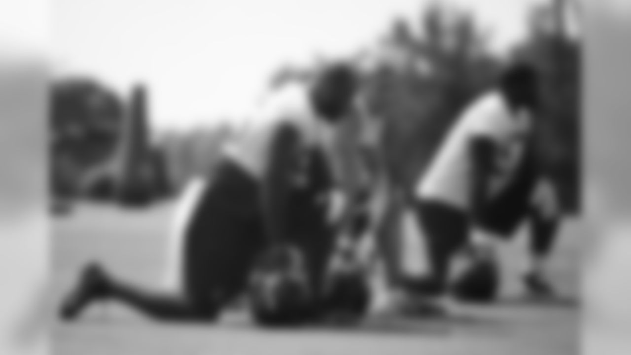 Defensive ends John Abraham and Kroy Beirmann take a knee during practice // 2012 Atlanta Falcons Minicamp - Day 2 // June 20, 2012 // Flowery Branch, Ga. -
