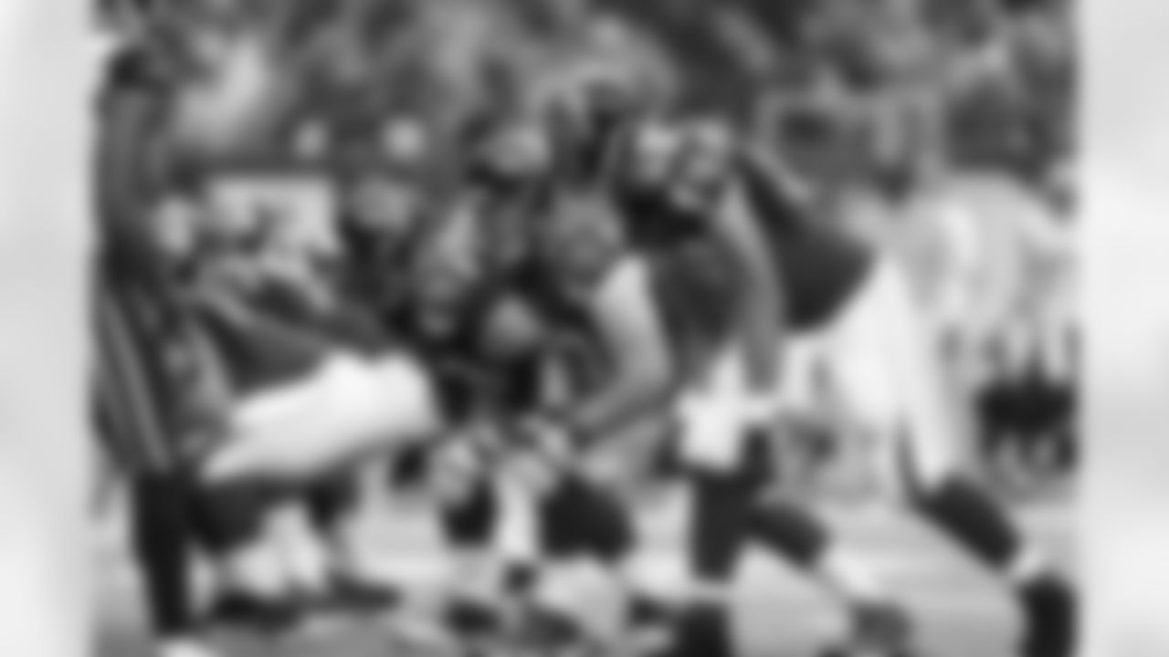 TE Tony Gonzalez looks to his right at T Sam Baker