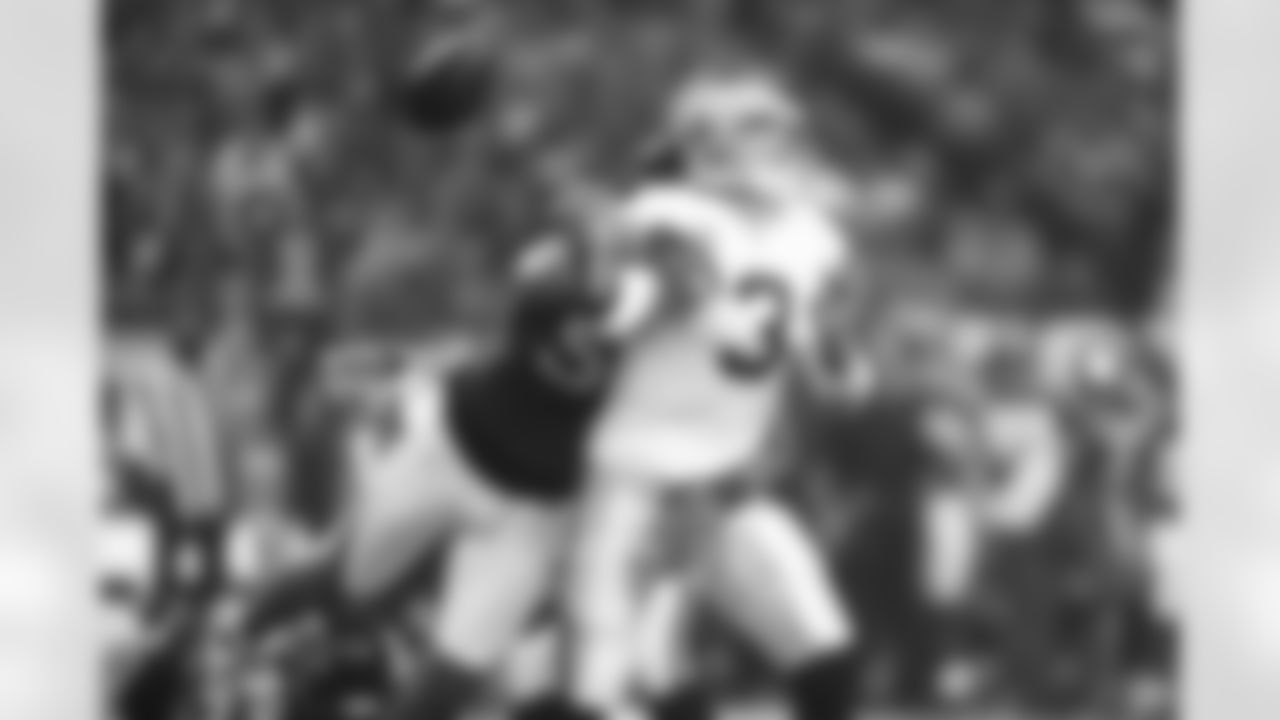 DE John Abraham brings a blow to Oakland quarterback Carson Palmer, causing a fumble.