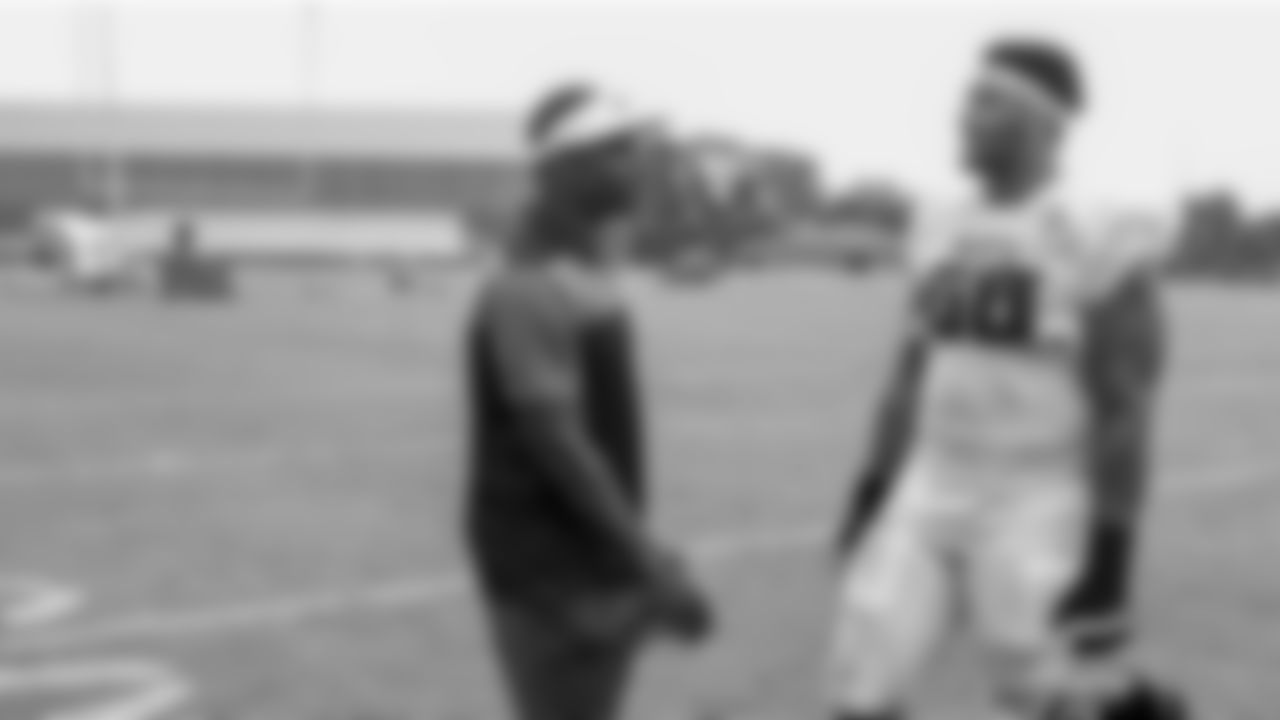 Atlanta Falcons offensive tackle Elijah Wilkinson #68 with Michael Vick during AT&T Atlanta Falcons Training Camp at Atlanta Falcons Training Facility in Flowery Branch, Georgia, on Wednesday, August 10, 2022. (Photo by Shanna Lockwood/Atlanta Falcons)