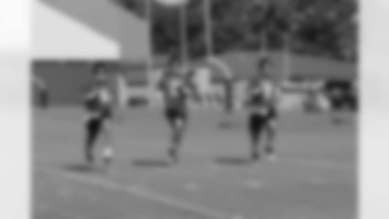 The quarterbacks warm up // 2011 Russell Athletic Training Camp - Day 10 // August 10, 2011 // Flowery Branch, Ga. —