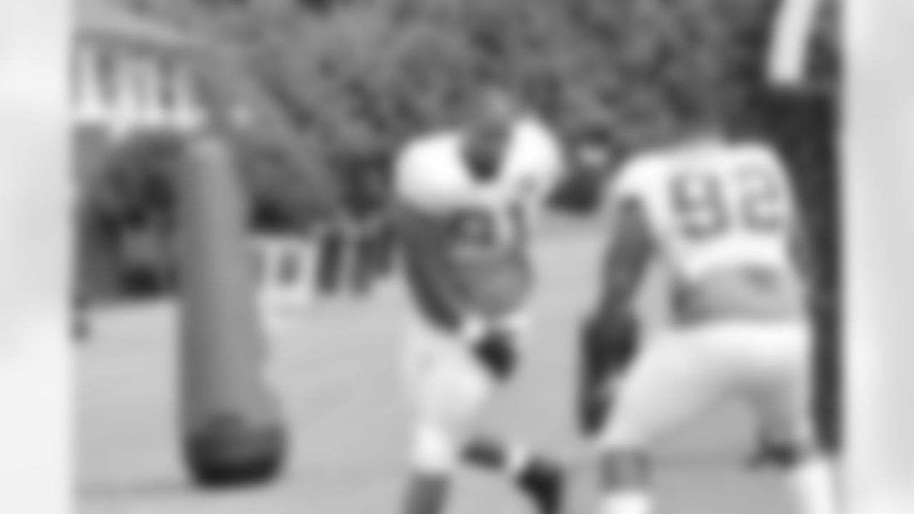 DT Corey Peters goes through a drill with DT Travian Robertson