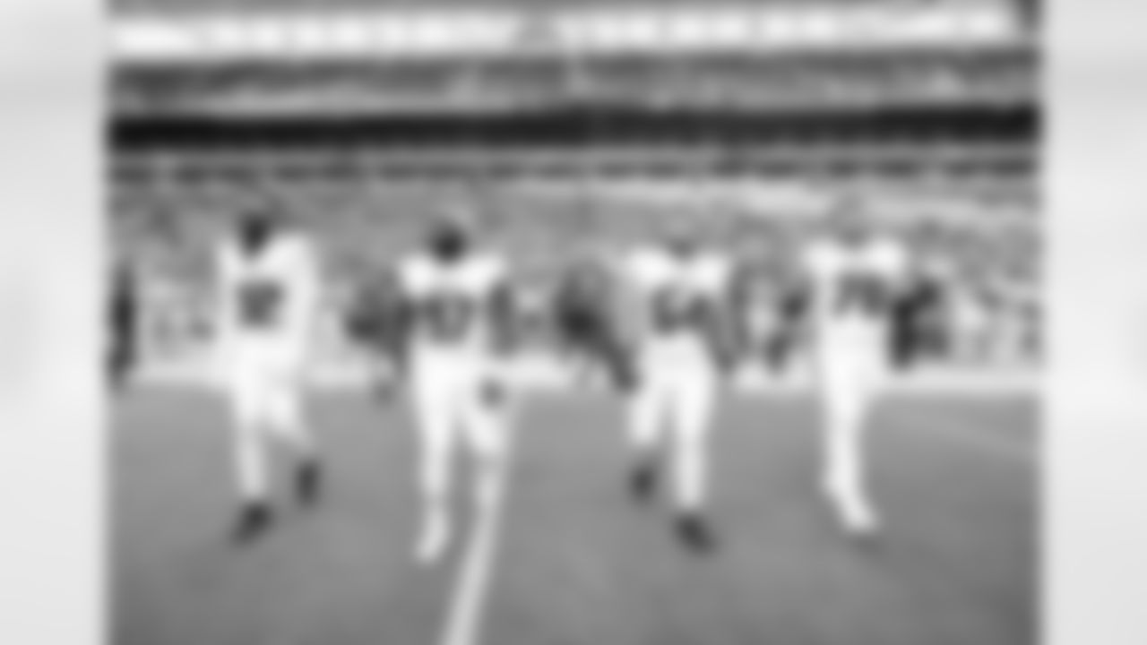 Captains walk to midfield for the toss prior to the Preseason Game against the Miami Dolphins at Hard Rock Stadium in Miami Gardens, Florida on Friday, August 11, 2023. (Photo by Jay Bendlin/Atlanta Falcons)