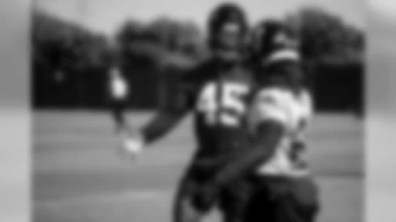 Atlanta Falcons linebacker Deion Jones #45 greets running back Devonta Freeman #24 during practice. (Photo by Kara Durrette/Atlanta Falcons).