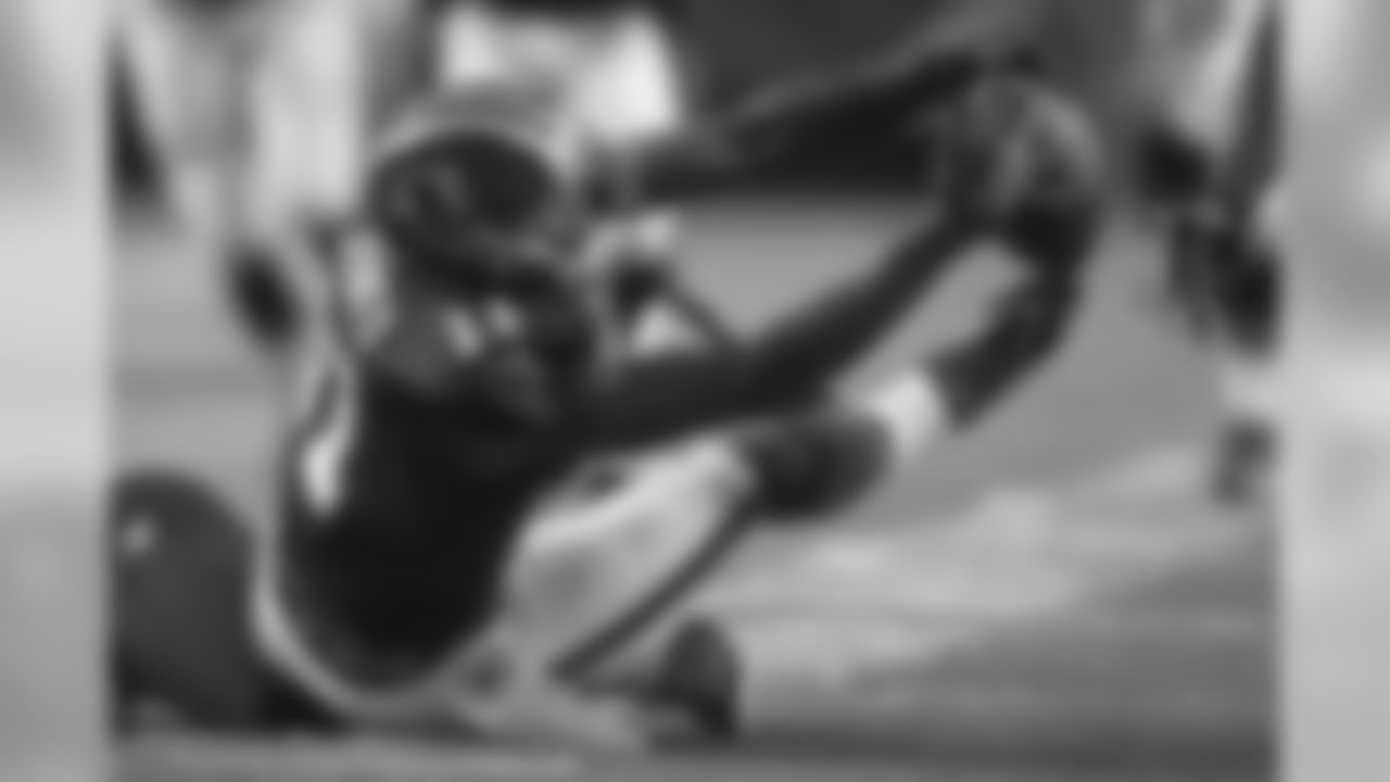 Wide receiver Julio Jones reaches out to try to snag this pass from the seat of his pants.