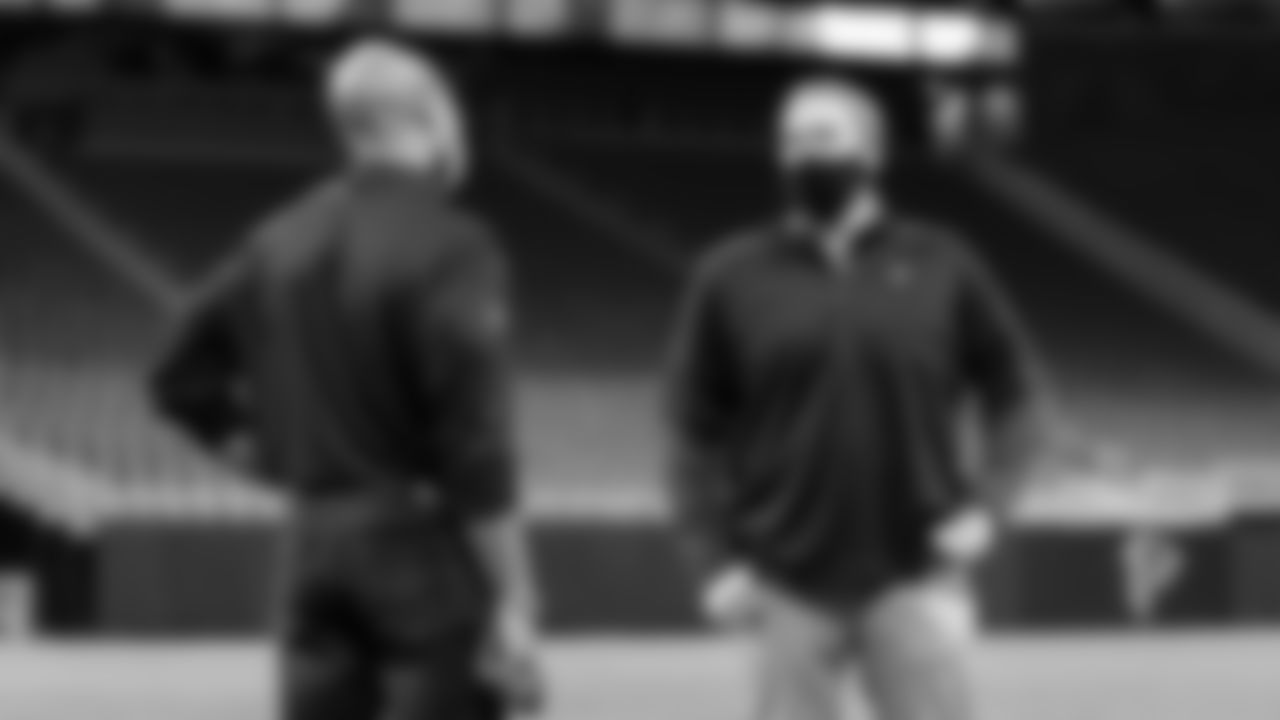 Atlanta Falcons head coach Arthur Smith and general manager Terry Fontenot talk on the field during their first visit to Mercedes-Benz Stadium in Atlanta, Georgia, on Thursday January 21, 2021.