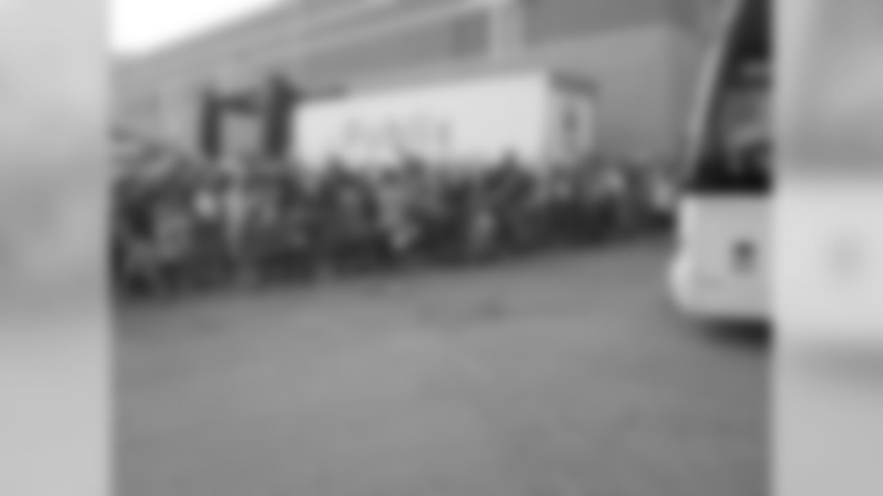 Fans cheer as Falcons players arrive // 2011 Friday Night Lights // August 5, 2011 // Norcross, Ga. —