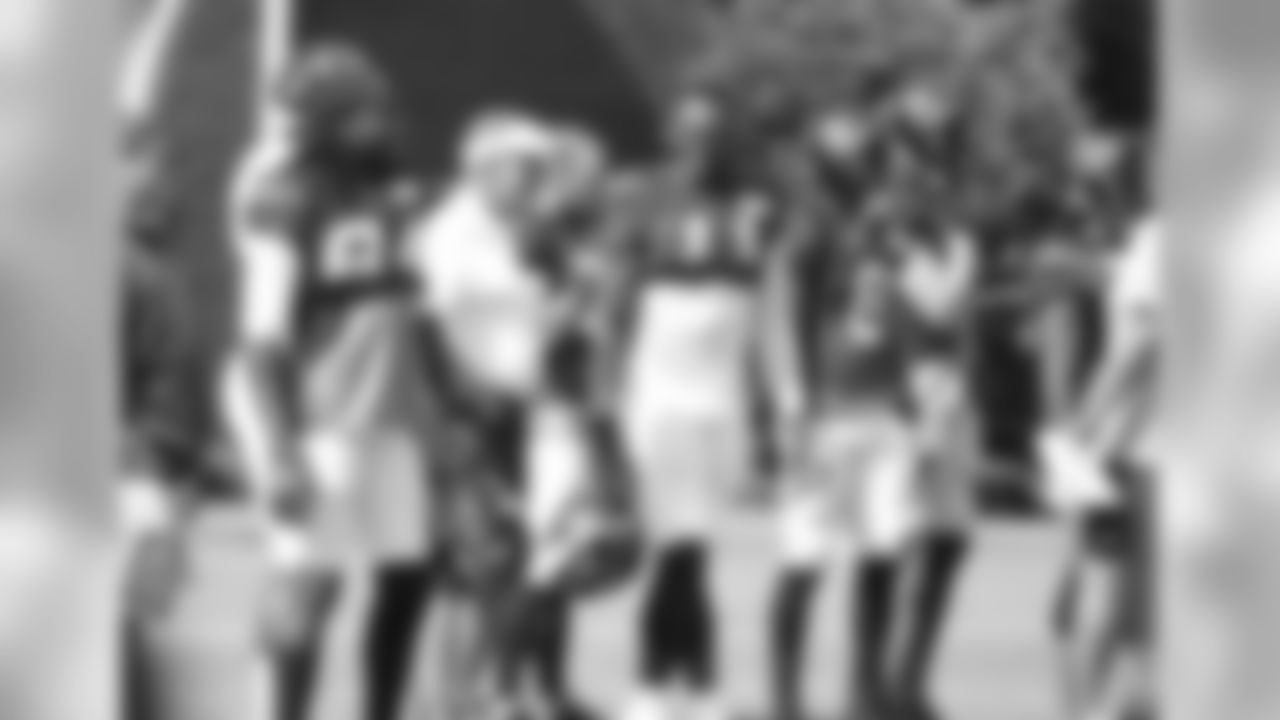 Falcons Owner and Chairman, Arthur Blank, stands on the sidelines with WR Roddy White and WR Julio Jones