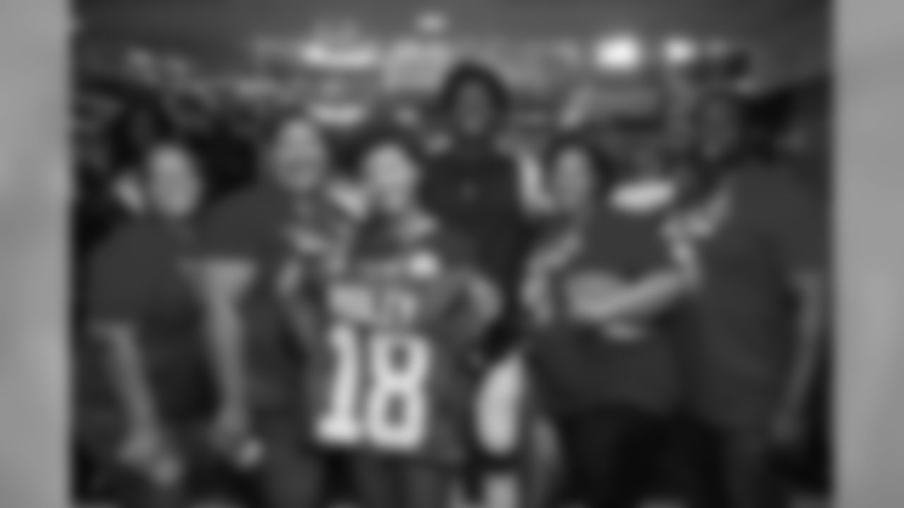 Atlanta Falcons wide receiver Calvin Ridley #18 poses for a photo with TAPS family members during AT&T Military Appreciation Training Camp at Mercedes-Benz Stadium in Atlanta, Georgia, on Sunday August 4, 2019. (Photo by Logan Riley/Atlanta Falcons)